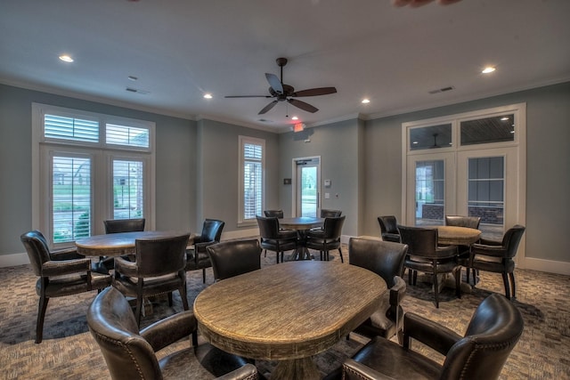 carpeted dining area featuring baseboards, recessed lighting, ornamental molding, and ceiling fan