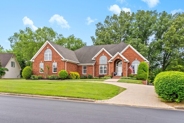 411 Lake Pointe Dr, Clarksville, TN 37043 - view of front of home with brick siding and a front yard