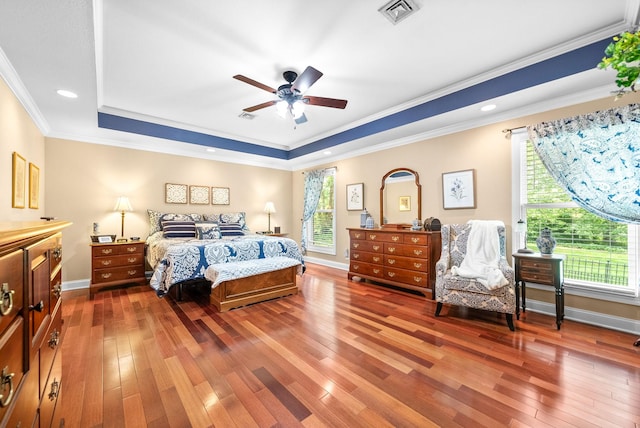 411 Lake Pointe Dr, Clarksville, TN 37043 - bedroom with hardwood / wood-style floors, a tray ceiling, baseboards, ornamental molding, and ceiling fan
