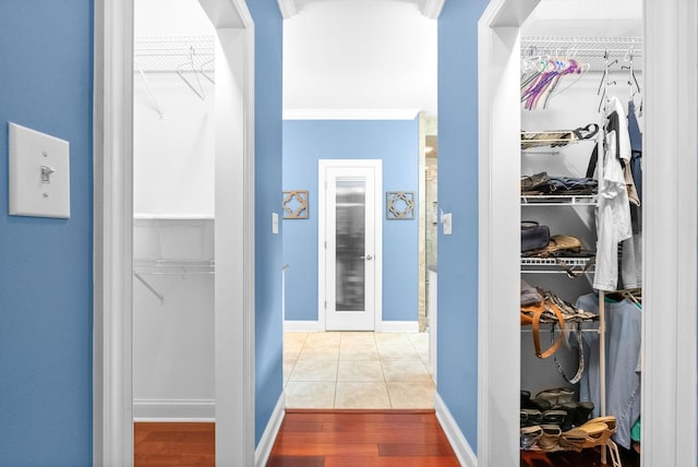 411 Lake Pointe Dr, Clarksville, TN 37043 - hall featuring wood finished floors, ornamental molding, and baseboards