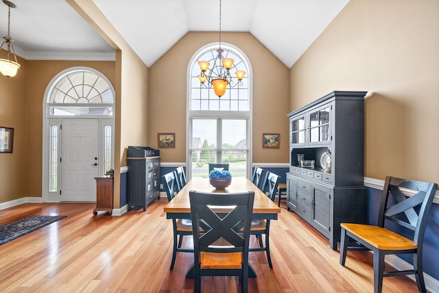411 Lake Pointe Dr, Clarksville, TN 37043 - dining room with high vaulted ceiling, a chandelier, and light wood-style flooring