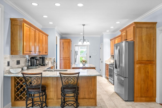 411 Lake Pointe Dr, Clarksville, TN 37043 - kitchen featuring appliances with stainless steel finishes, a sink, a peninsula, decorative backsplash, and light stone counters