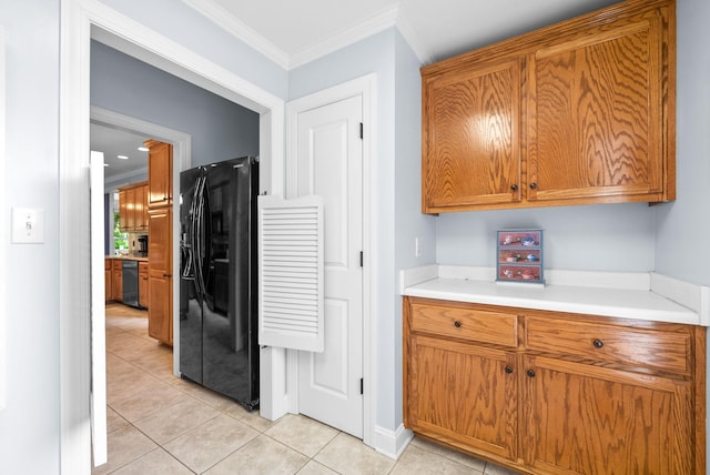 411 Lake Pointe Dr, Clarksville, TN 37043 - kitchen with black refrigerator with ice dispenser, brown cabinetry, ornamental molding, light tile patterned floors, and light countertops