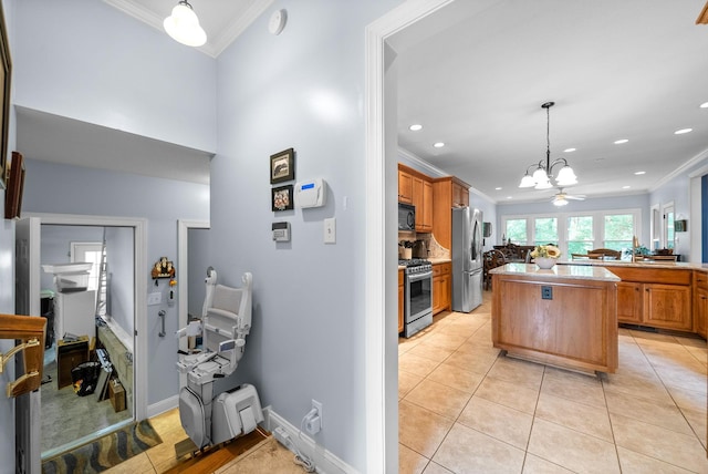 411 Lake Pointe Dr, Clarksville, TN 37043 - kitchen with stainless steel appliances, crown molding, light tile patterned floors, light countertops, and a chandelier