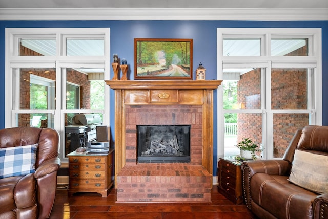 411 Lake Pointe Dr, Clarksville, TN 37043 - living room featuring dark wood-type flooring, a brick fireplace, and ornamental molding