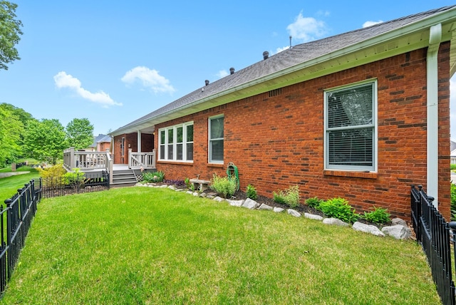 411 Lake Pointe Dr, Clarksville, TN 37043 - rear view of property with brick siding, a deck, and a shingled roof
