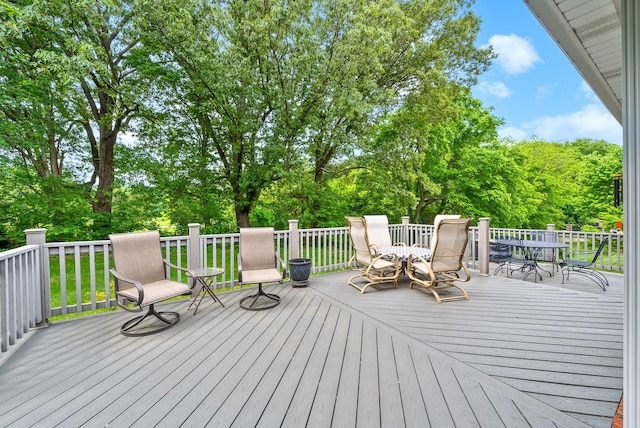 411 Lake Pointe Dr, Clarksville, TN 37043 - deck with outdoor dining area and view of scattered trees