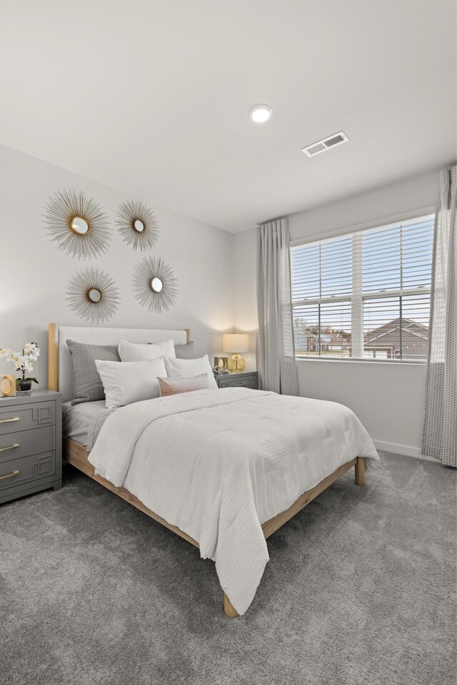carpeted bedroom featuring baseboards