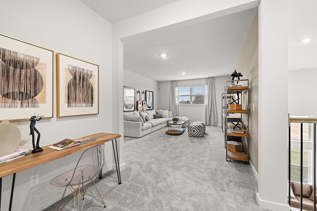carpeted living area with baseboards, recessed lighting, and an office area