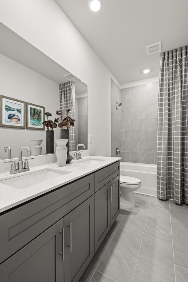 bathroom featuring toilet, double vanity, shower / tub combo, tile patterned floors, and recessed lighting