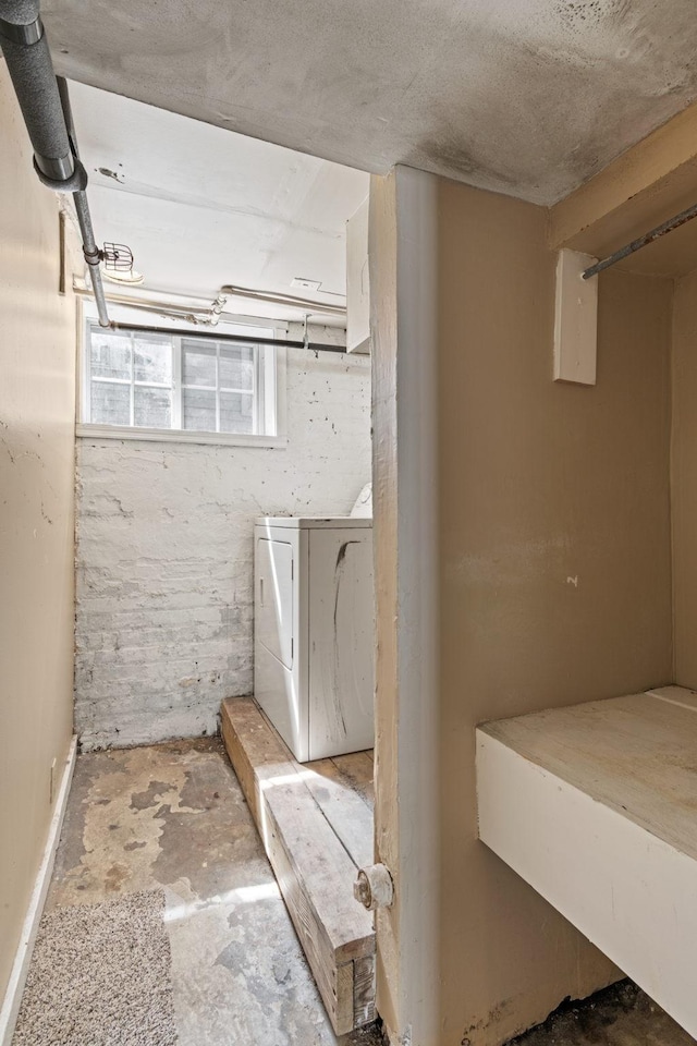 below grade area featuring washer / dryer