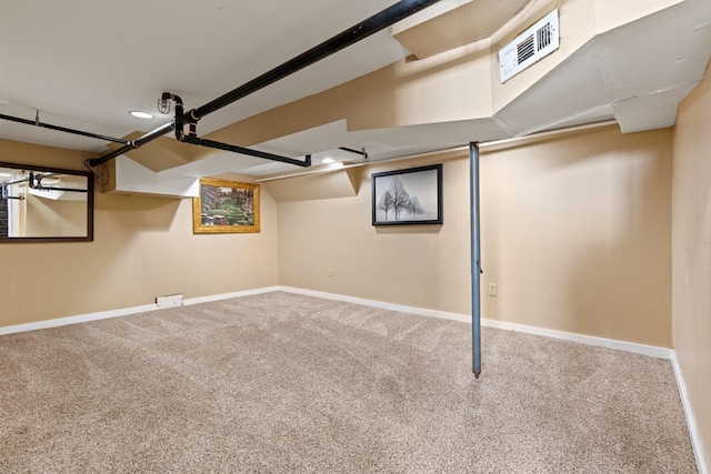 below grade area featuring carpet floors and baseboards