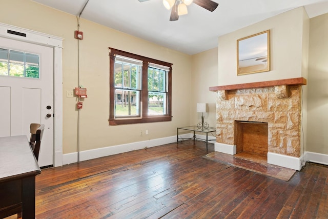 foyer entrance with plenty of natural light, ceiling fan, and baseboards