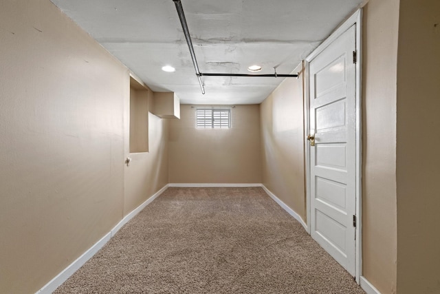below grade area with carpet flooring and baseboards