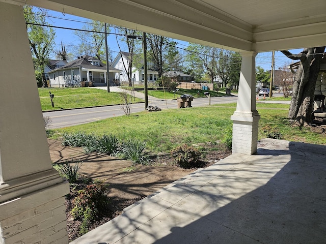 view of patio with covered porch and a residential view