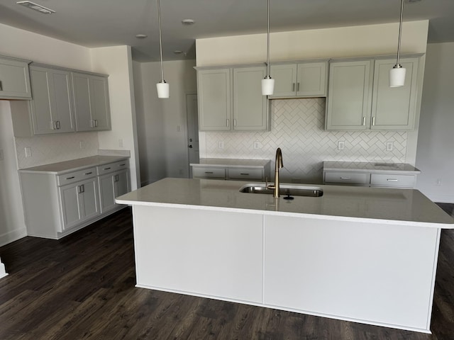 1085 June Wilde Rdg, Spring Hill, TN 37174 - kitchen with a sink, backsplash, an island with sink, gray cabinetry, and dark wood-type flooring