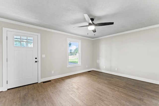 1950 Norton Rd, Lawrenceburg, TN 38464 - foyer entrance featuring a ceiling fan, wood finished floors, baseboards, crown molding, and a textured ceiling
