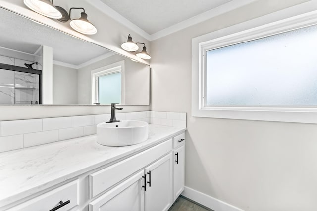 1950 Norton Rd, Lawrenceburg, TN 38464 - bathroom featuring backsplash, ornamental molding, plenty of natural light, vanity, and baseboards