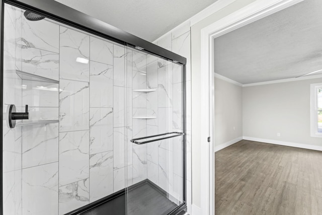 1950 Norton Rd, Lawrenceburg, TN 38464 - full bathroom with baseboards, wood finished floors, a marble finish shower, ornamental molding, and a textured ceiling