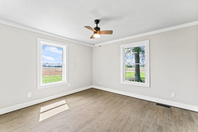1950 Norton Rd, Lawrenceburg, TN 38464 - unfurnished room featuring baseboards, wood finished floors, a ceiling fan, and ornamental molding