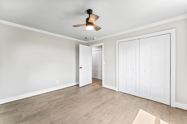 1950 Norton Rd, Lawrenceburg, TN 38464 - unfurnished bedroom featuring wood finished floors, ornamental molding, a closet, baseboards, and a ceiling fan