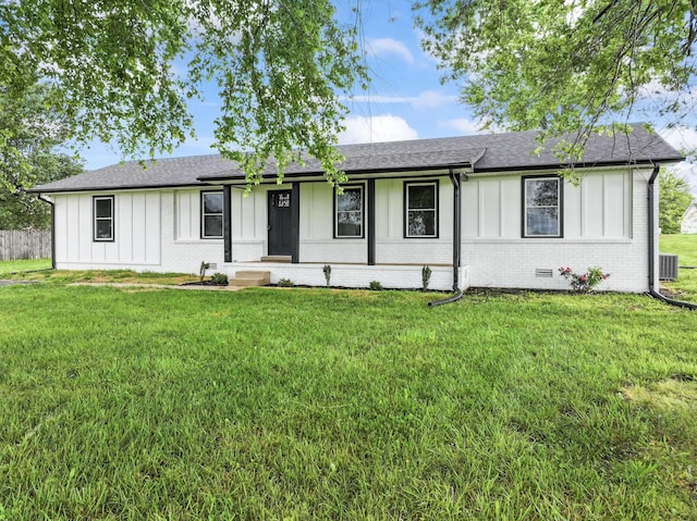 1950 Norton Rd, Lawrenceburg, TN 38464 - ranch-style house with board and batten siding, a front yard, brick siding, and a shingled roof