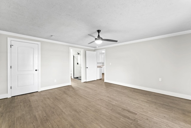 1950 Norton Rd, Lawrenceburg, TN 38464 - unfurnished bedroom with a textured ceiling, baseboards, ornamental molding, wood finished floors, and a ceiling fan
