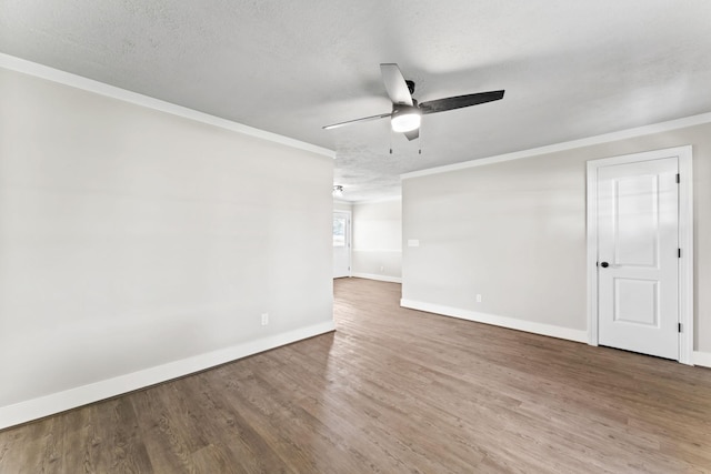 1950 Norton Rd, Lawrenceburg, TN 38464 - unfurnished room featuring ceiling fan, baseboards, crown molding, wood finished floors, and a textured ceiling