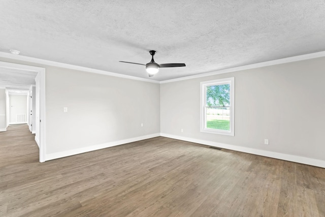 1950 Norton Rd, Lawrenceburg, TN 38464 - empty room with a textured ceiling, wood finished floors, baseboards, ceiling fan, and ornamental molding