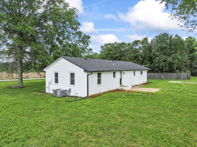 1950 Norton Rd, Lawrenceburg, TN 38464 - back of house with cooling unit, brick siding, and a shingled roof
