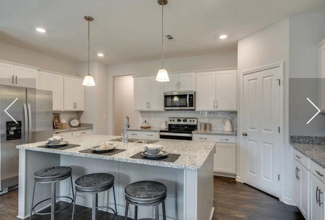 6161 Worthingtion Rd, Columbia, TN 38401 - kitchen featuring appliances with stainless steel finishes, dark wood-type flooring, white cabinetry, and recessed lighting