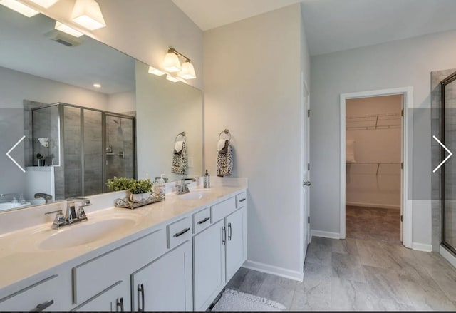 6161 Worthingtion Rd, Columbia, TN 38401 - full bath with a shower stall, double vanity, a walk in closet, and recessed lighting