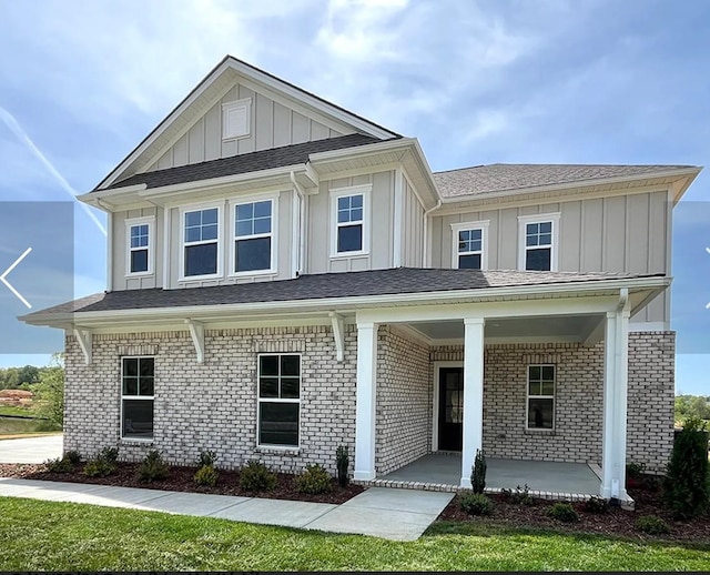 6161 Worthingtion Rd, Columbia, TN 38401 - view of front of home featuring board and batten siding, a porch, and brick siding