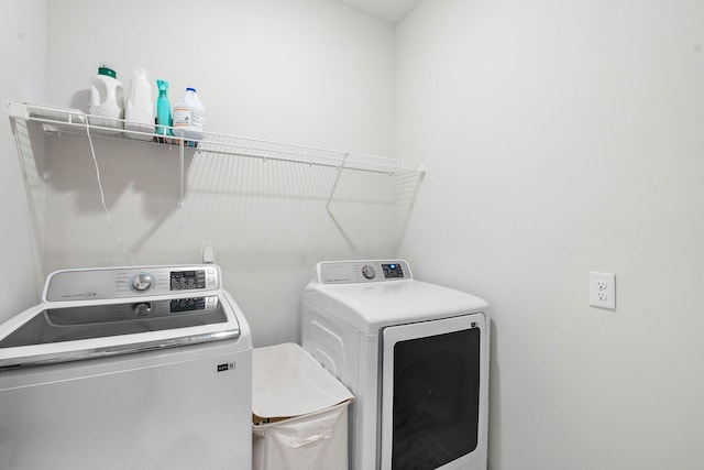 washroom featuring separate washer and dryer