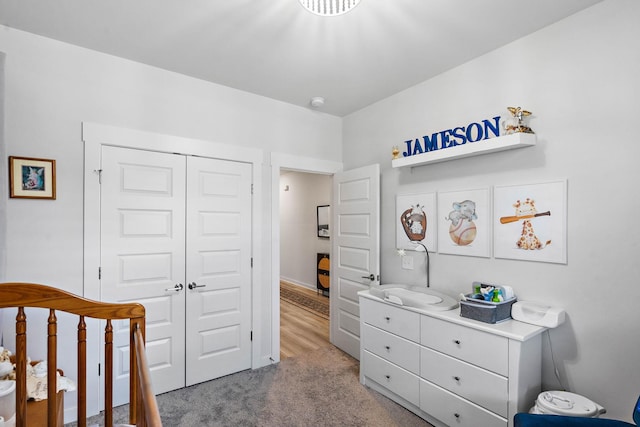 carpeted bedroom with a closet