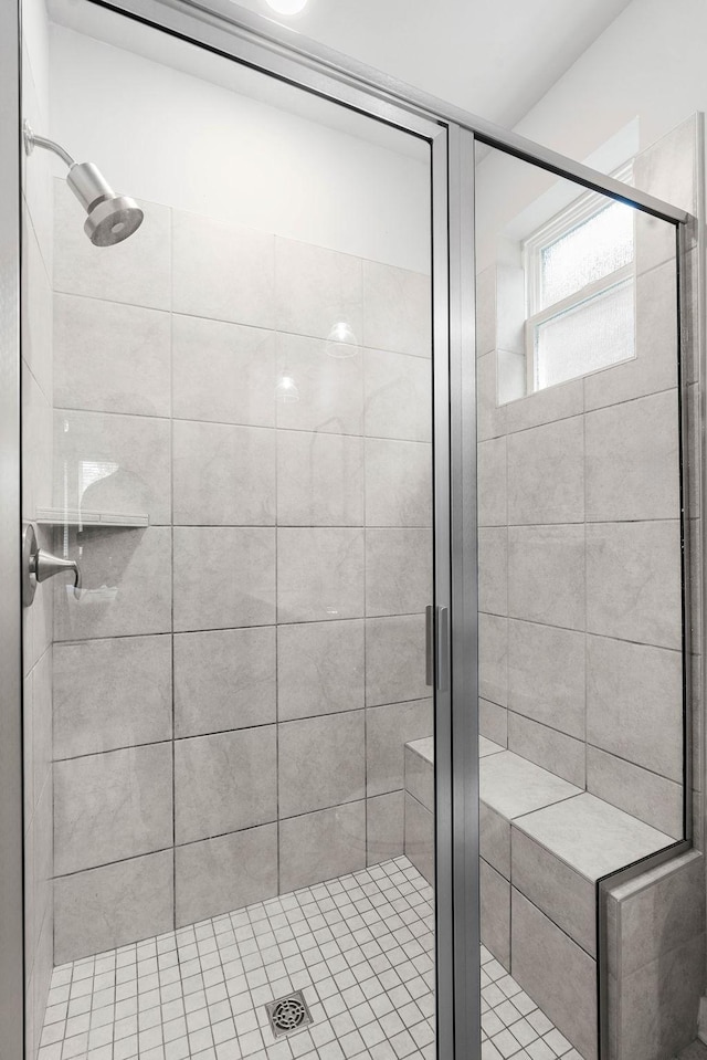 full bath with a shower stall