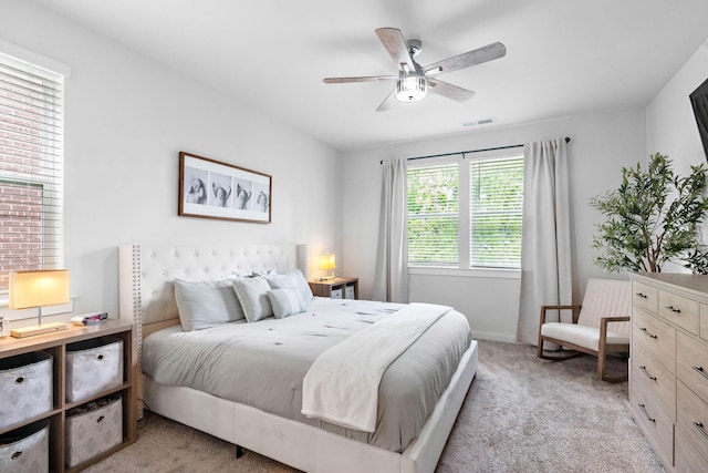 bedroom with light colored carpet and ceiling fan