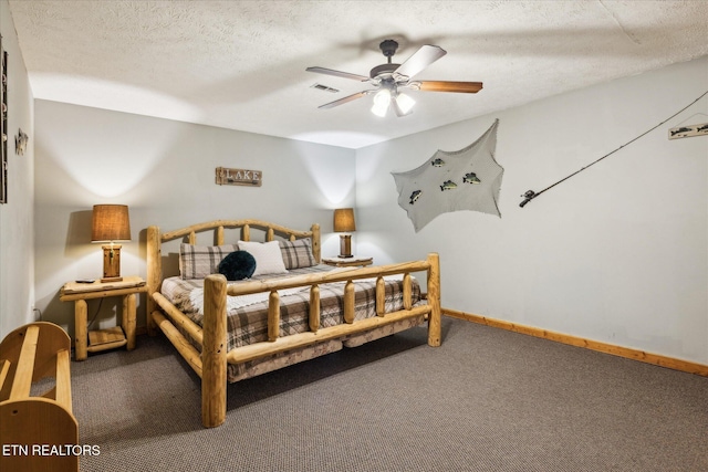 1640 Bench Mountain Way, Sevierville, TN 37862 - carpeted bedroom featuring a textured ceiling, a ceiling fan, and baseboards