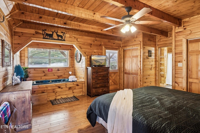 1640 Bench Mountain Way, Sevierville, TN 37862 - bedroom featuring wood walls, beam ceiling, wooden ceiling, multiple windows, and wood-type flooring