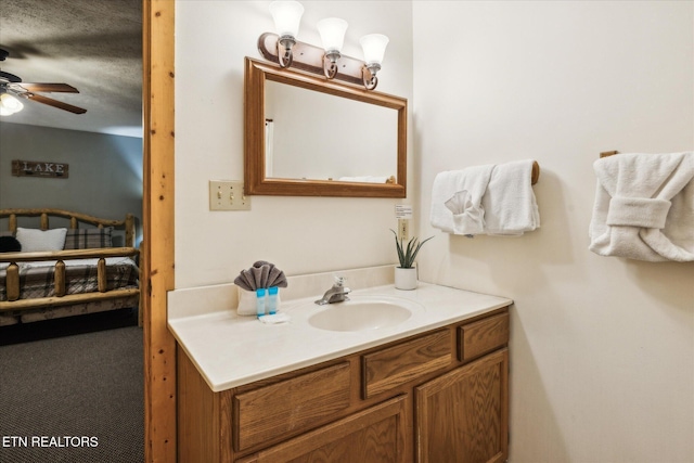 1640 Bench Mountain Way, Sevierville, TN 37862 - bathroom featuring ceiling fan, vanity, and a textured ceiling