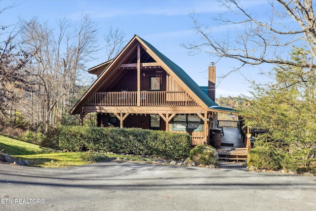 1640 Bench Mountain Way, Sevierville, TN 37862 - view of front facade featuring a chimney and board and batten siding