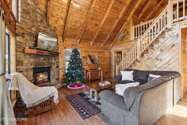1640 Bench Mountain Way, Sevierville, TN 37862 - living room with wooden ceiling, hardwood / wood-style flooring, stairway, beam ceiling, and high vaulted ceiling