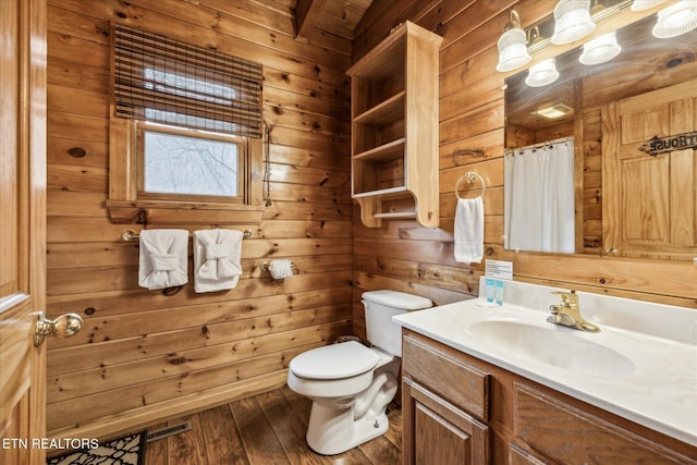 3514 Olde Tyme Way, Sevierville, TN 37862 - bathroom featuring toilet, wood finished floors, vanity, wooden walls, and a shower with shower curtain