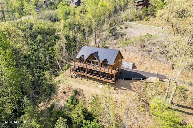 view from above of property featuring a forest