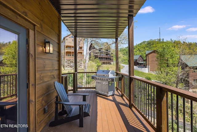 wooden deck with grilling area