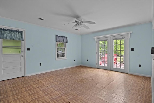 7158 Bahne Rd, Fairview, TN 37062 - empty room with plenty of natural light, ceiling fan, french doors, and baseboards