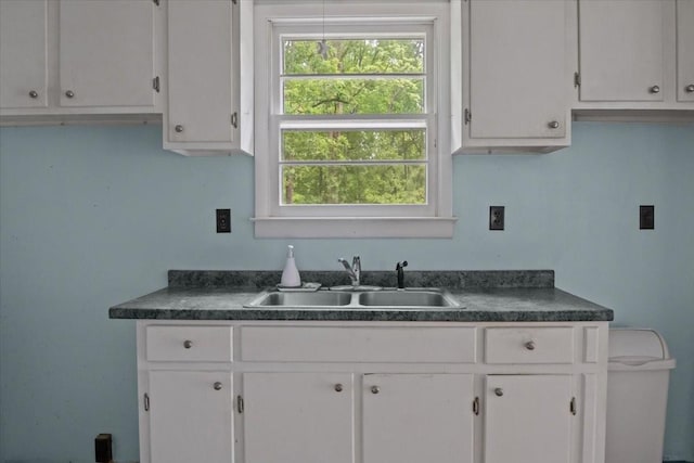 7158 Bahne Rd, Fairview, TN 37062 - kitchen with a sink, dark countertops, and white cabinetry