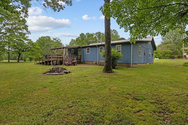 7158 Bahne Rd, Fairview, TN 37062 - rear view of house with a lawn and a wooden deck
