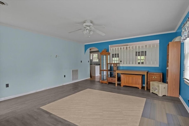 7158 Bahne Rd, Fairview, TN 37062 - interior space featuring baseboards, dark wood-style flooring, arched walkways, and a ceiling fan