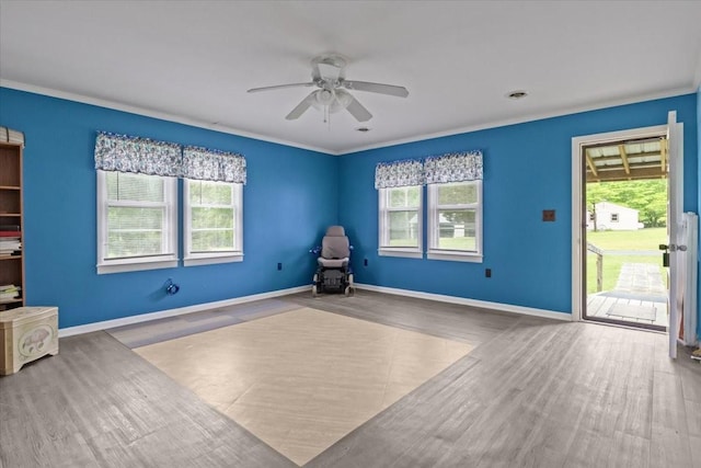 7158 Bahne Rd, Fairview, TN 37062 - unfurnished room featuring a ceiling fan, wood finished floors, ornamental molding, and baseboards